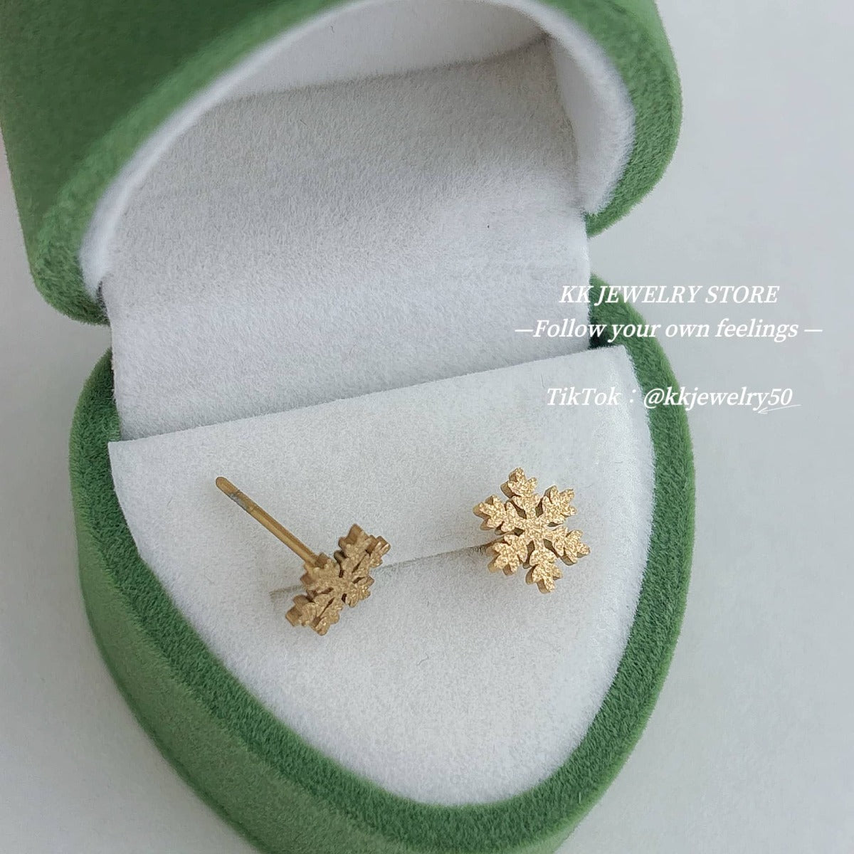 Two snowflake stud earrings