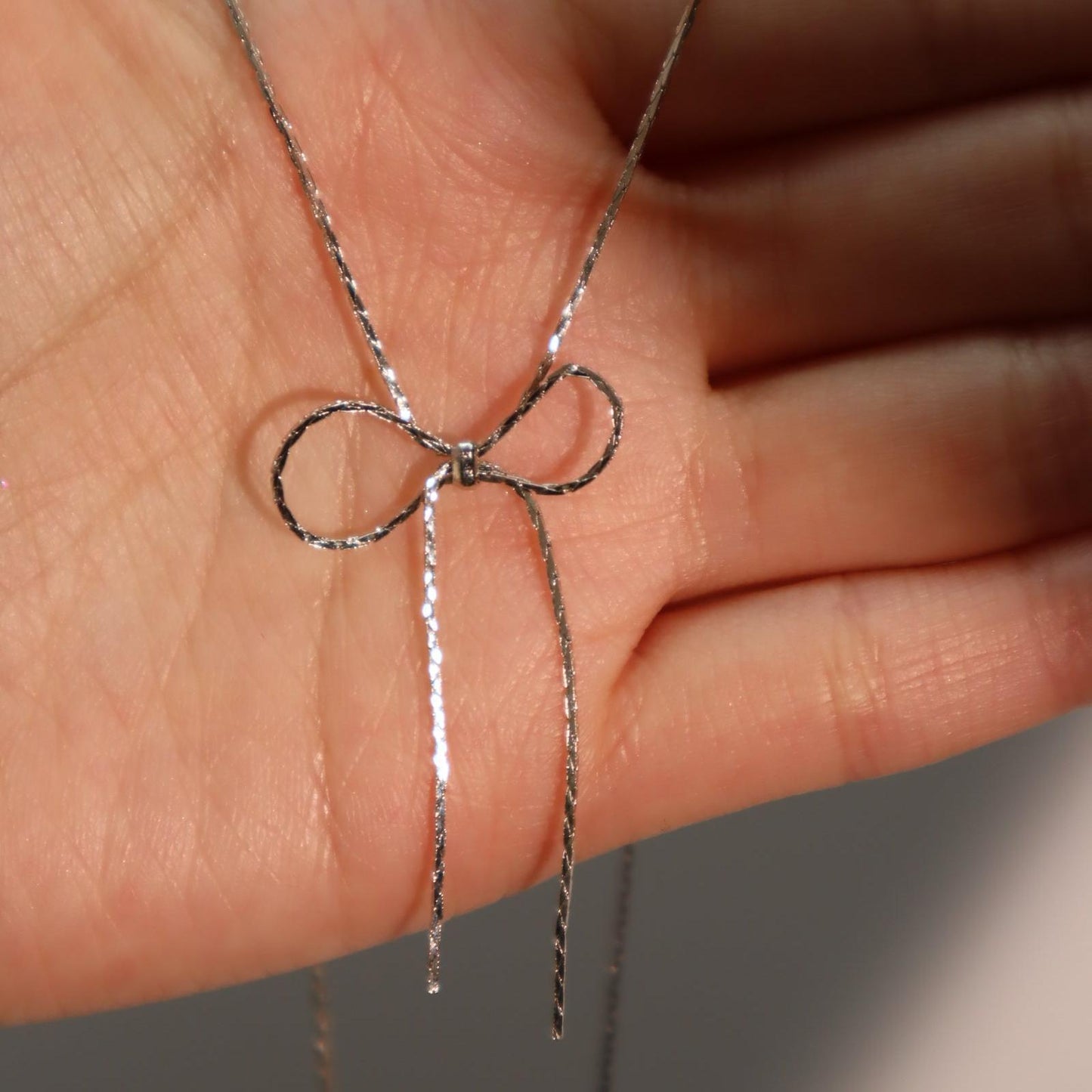 Titanium steel chain bow necklace