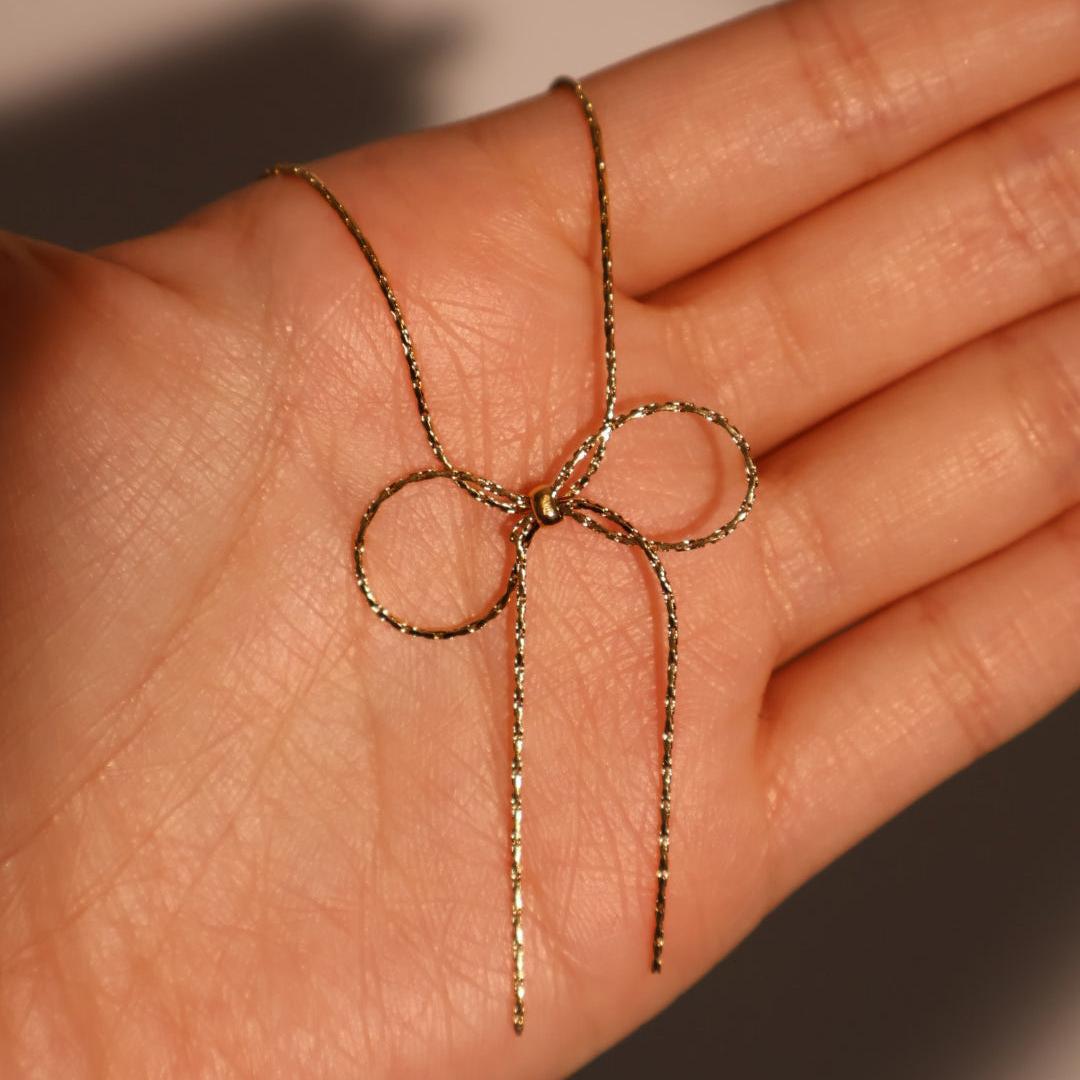 Titanium steel chain bow necklace