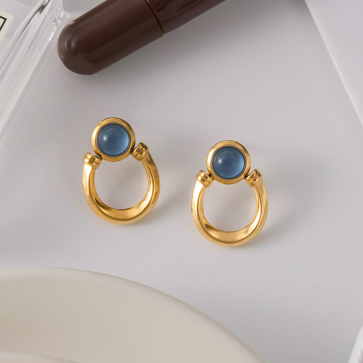 Stainless steel blue resin earrings