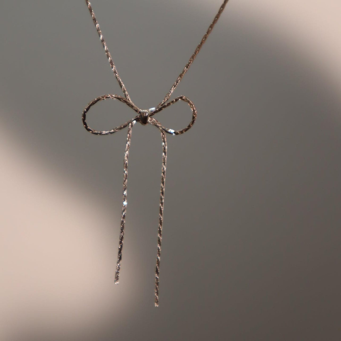 Titanium steel chain bow necklace