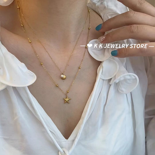 Double-layered starfish shell gold stacking necklace