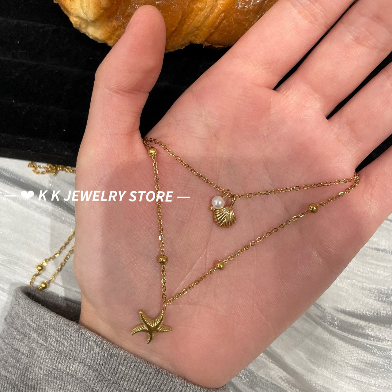 Double-layered starfish shell gold stacking necklace