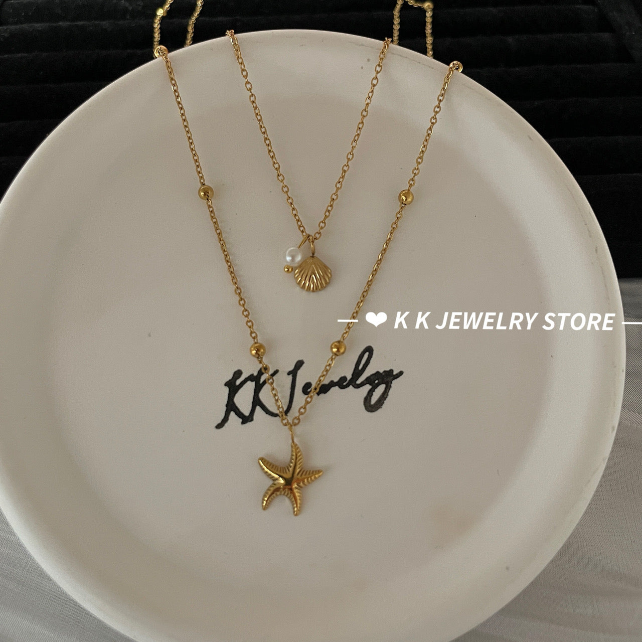 Double-layered starfish shell gold stacking necklace