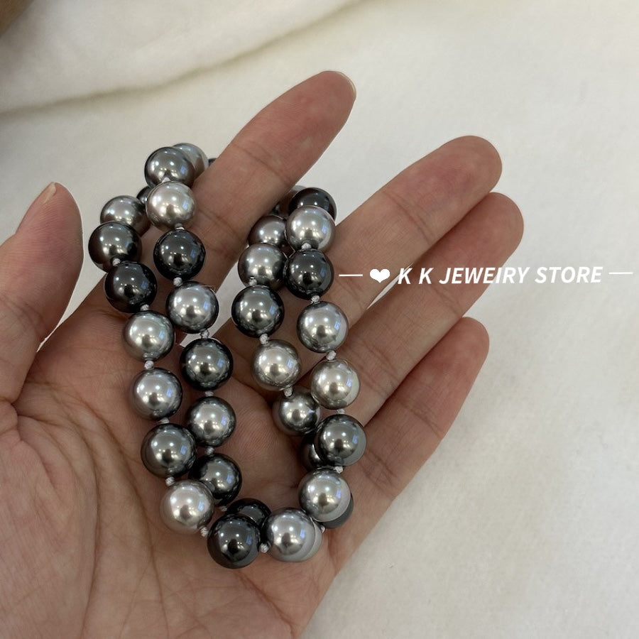 Necklace of faux melange gray-green pearls