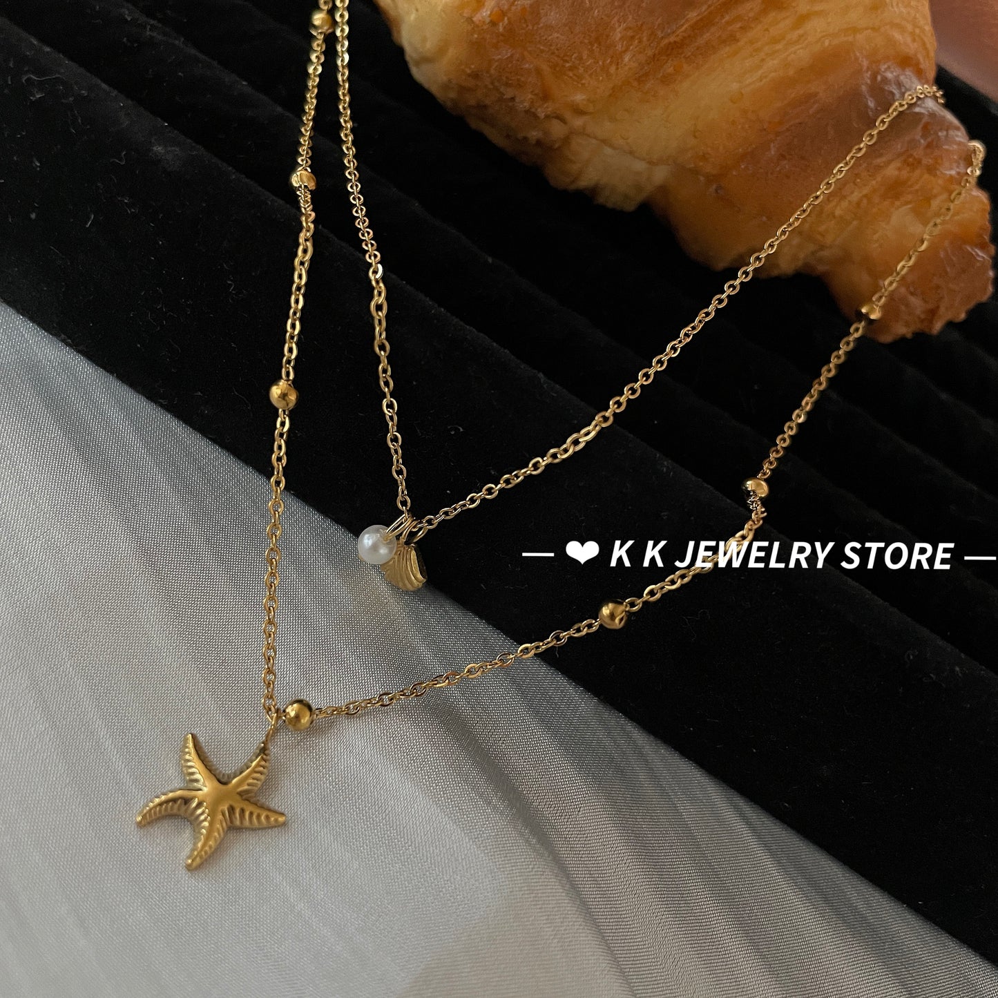 Double-layered starfish shell gold stacking necklace