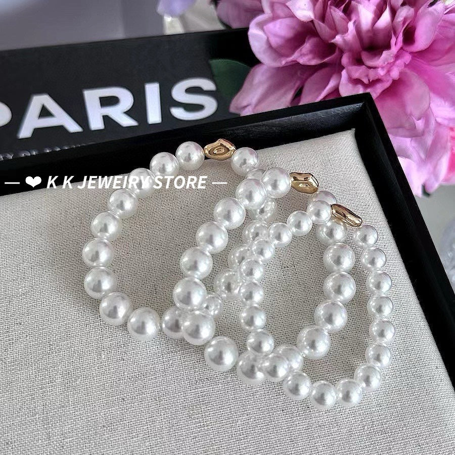 Imitation Australian white faux pearl bungee rope bracelet