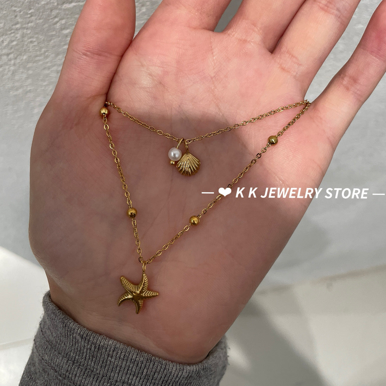 Double-layered starfish shell gold stacking necklace