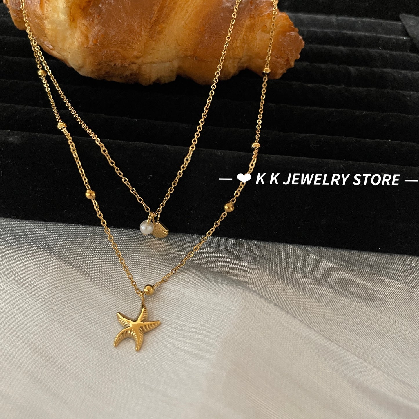 Double-layered starfish shell gold stacking necklace